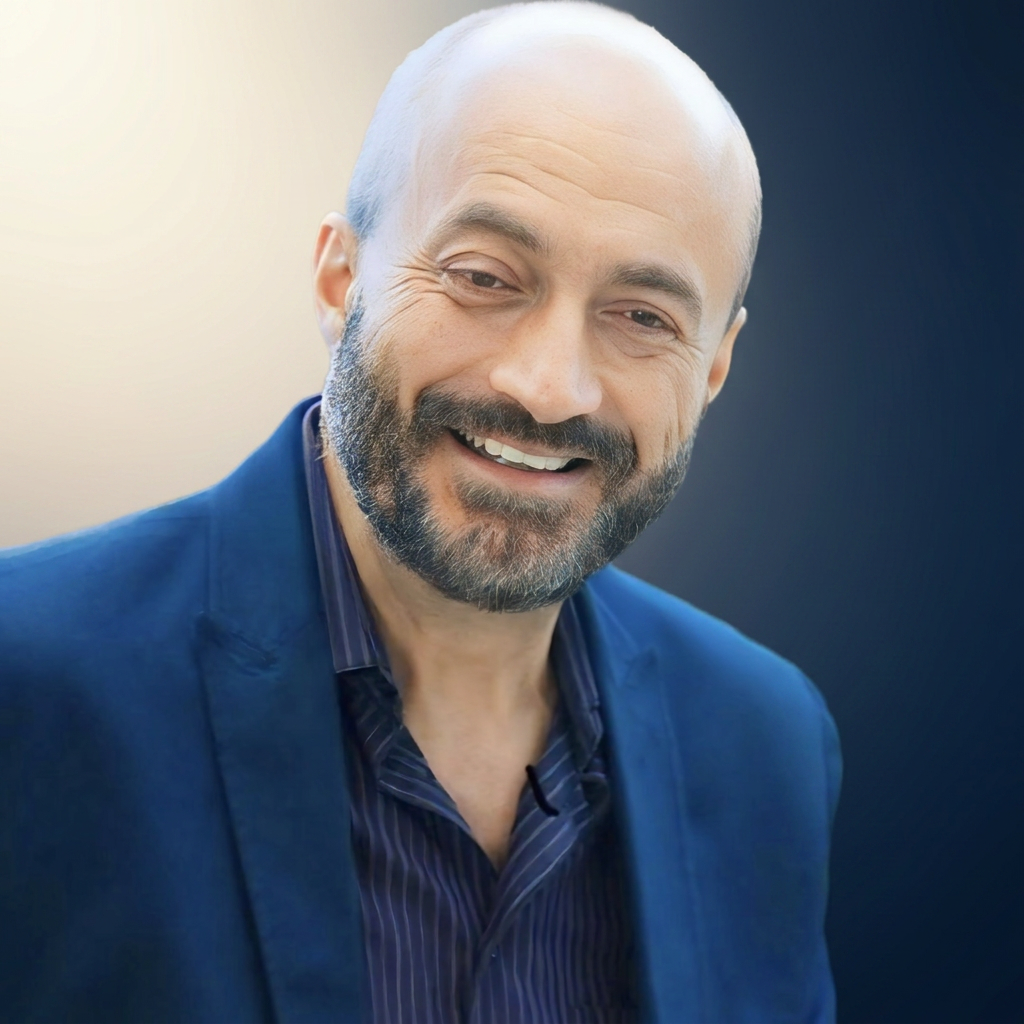Pastor Richard Risi smiling in a blue jacket
